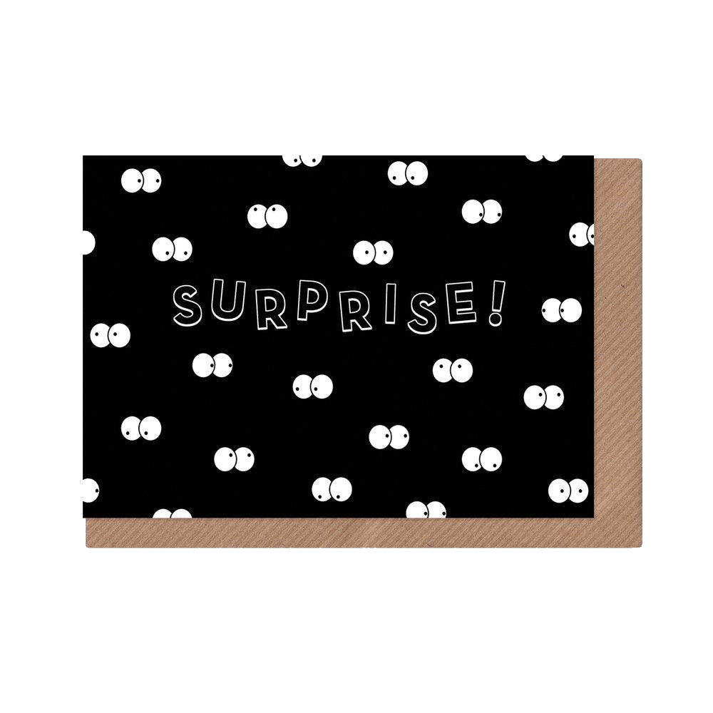 Surprise! Greeting card with black background and multiple cartoon eyes in the dark.